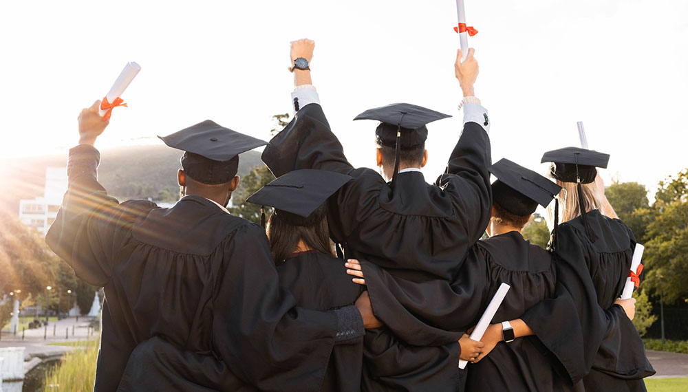 group of graduates in caps and gowns