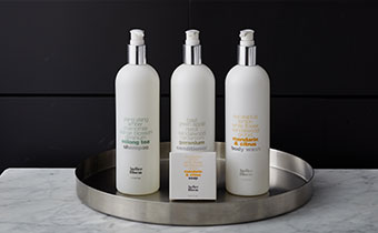 hotel bathroom shampoo and body soap bottles